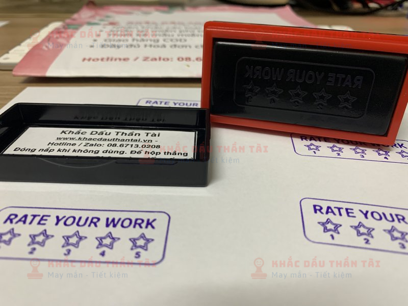 Khắc con dấu cho Giáo viên Trường quốc tế chữ Rate_Your_Work màu tím