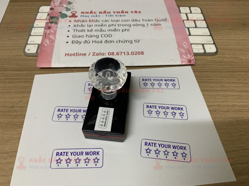 Khắc con dấu cho Giáo viên Trường quốc tế chữ Rate_Your_Work màu tím
