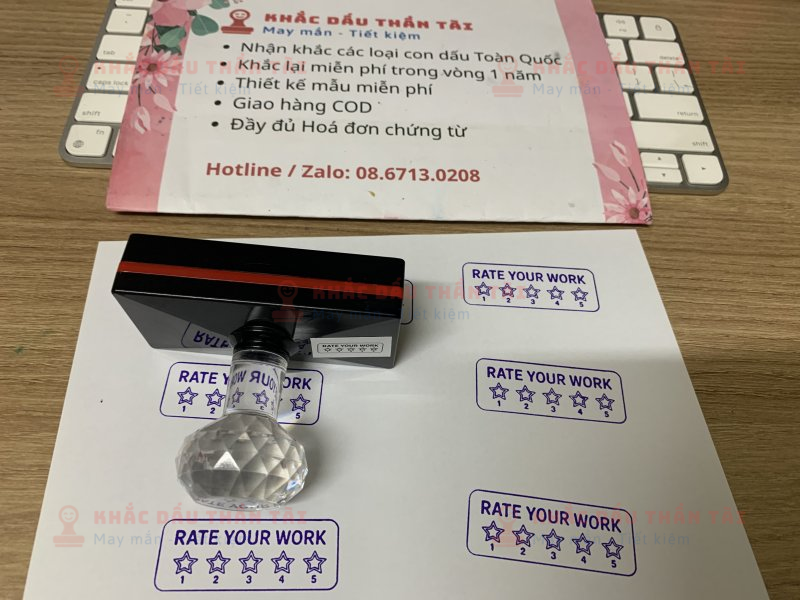 Khắc con dấu cho Giáo viên Trường quốc tế chữ Rate_Your_Work màu tím