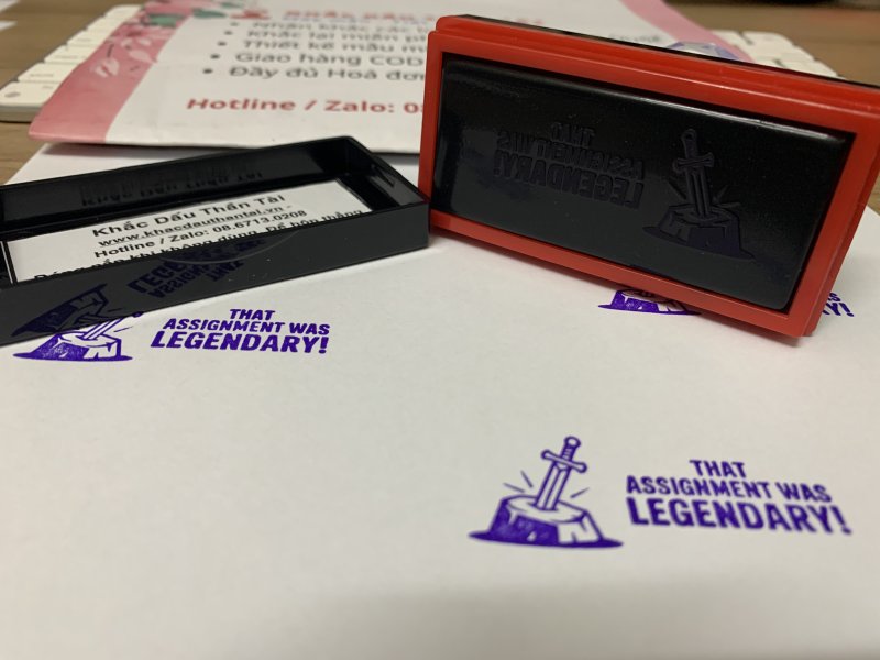 Khắc con dấu Giáo viên Trường quốc tế chữ That Assignment Was Legendary màu tím
