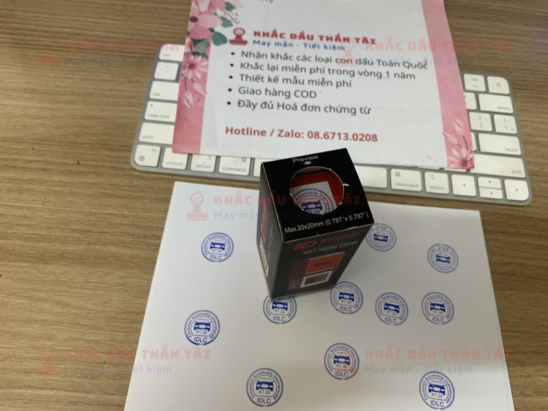 Khắc con dấu tròn Logo Oto IDLC, mực xanh, đóng giấy A4