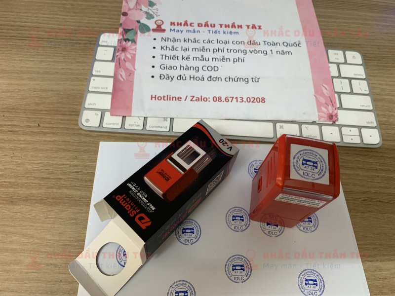 Khắc con dấu tròn Logo Oto IDLC, mực xanh, đóng giấy A4