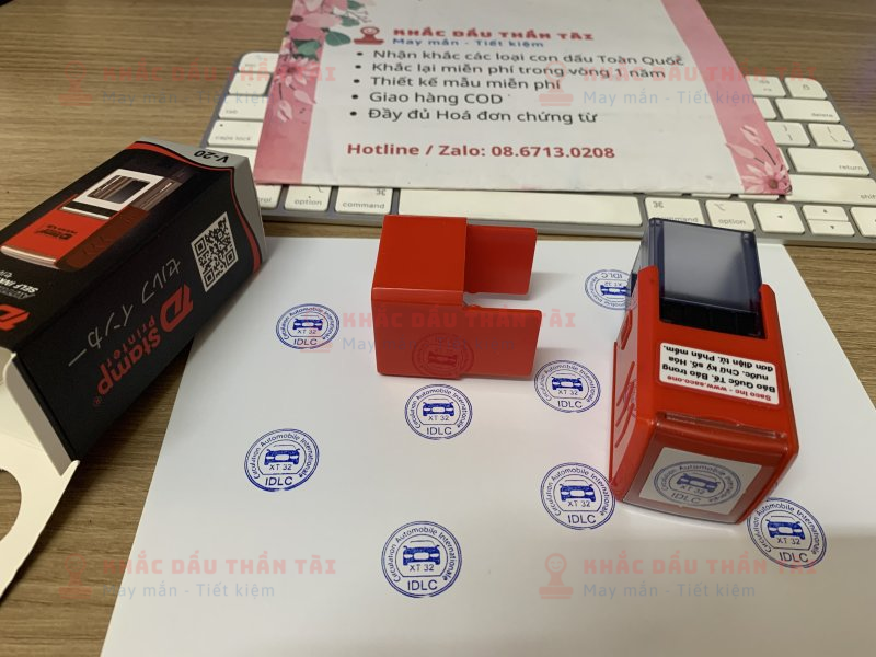 Khắc con dấu tròn Logo Oto IDLC, mực xanh, đóng giấy A4