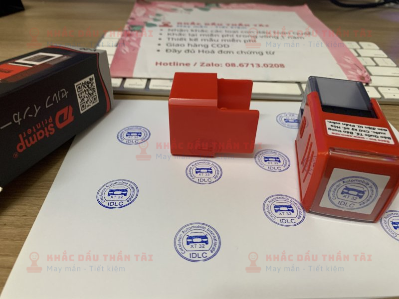 Khắc con dấu tròn Logo Oto IDLC, mực xanh, đóng giấy A4